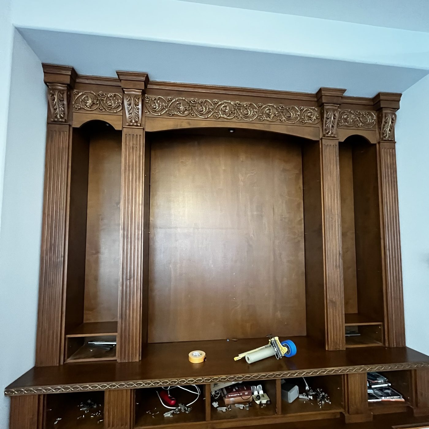 Entertainment centre before refinishing, in heavy dark stain — Luxe Carpentry Group, San Diego